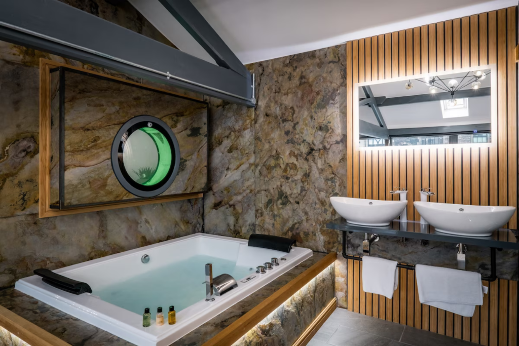 11 hot tub with marine window near it