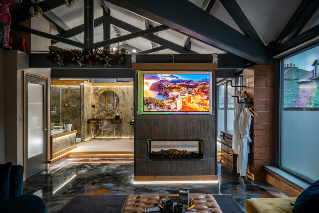 13 tv and fireplace with robes on the side