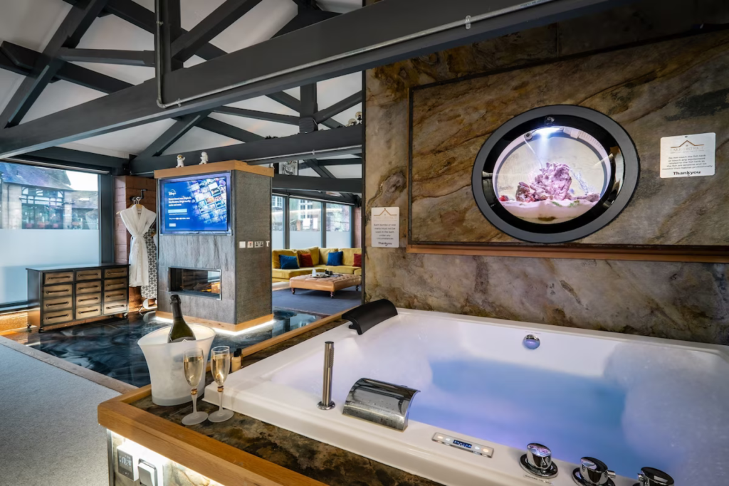 14 champagne next to the hot tub with tv on in the background