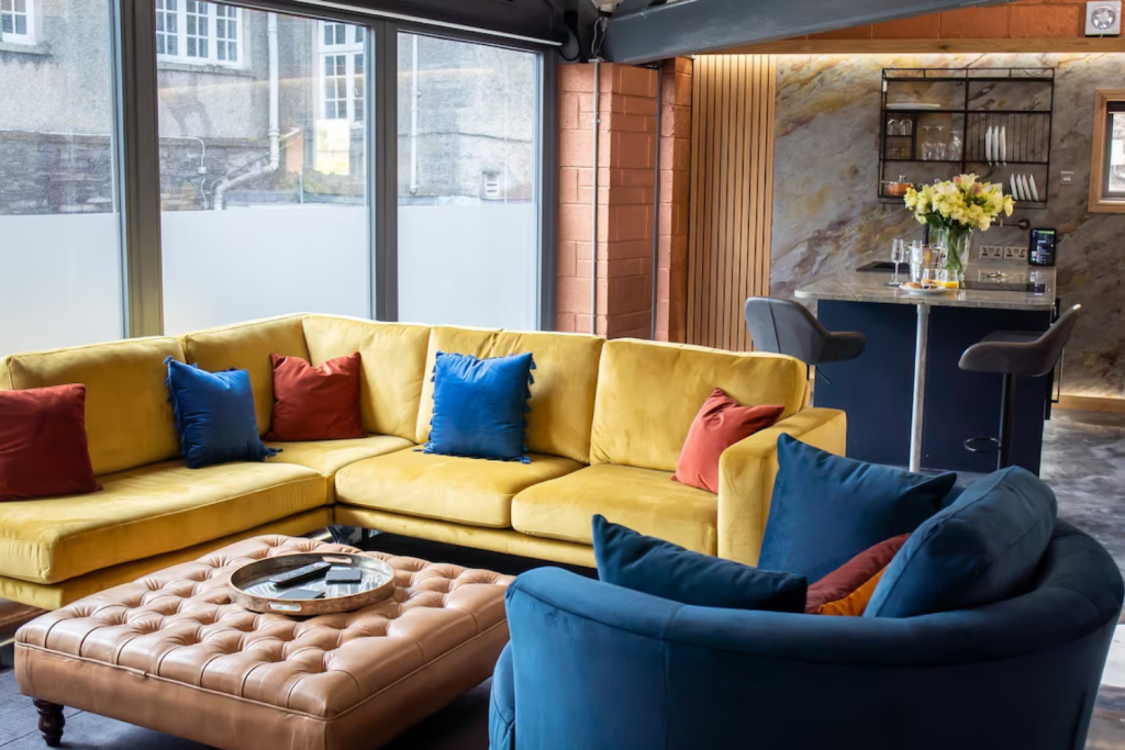 3 yellow and blur couch with red and blue pillows